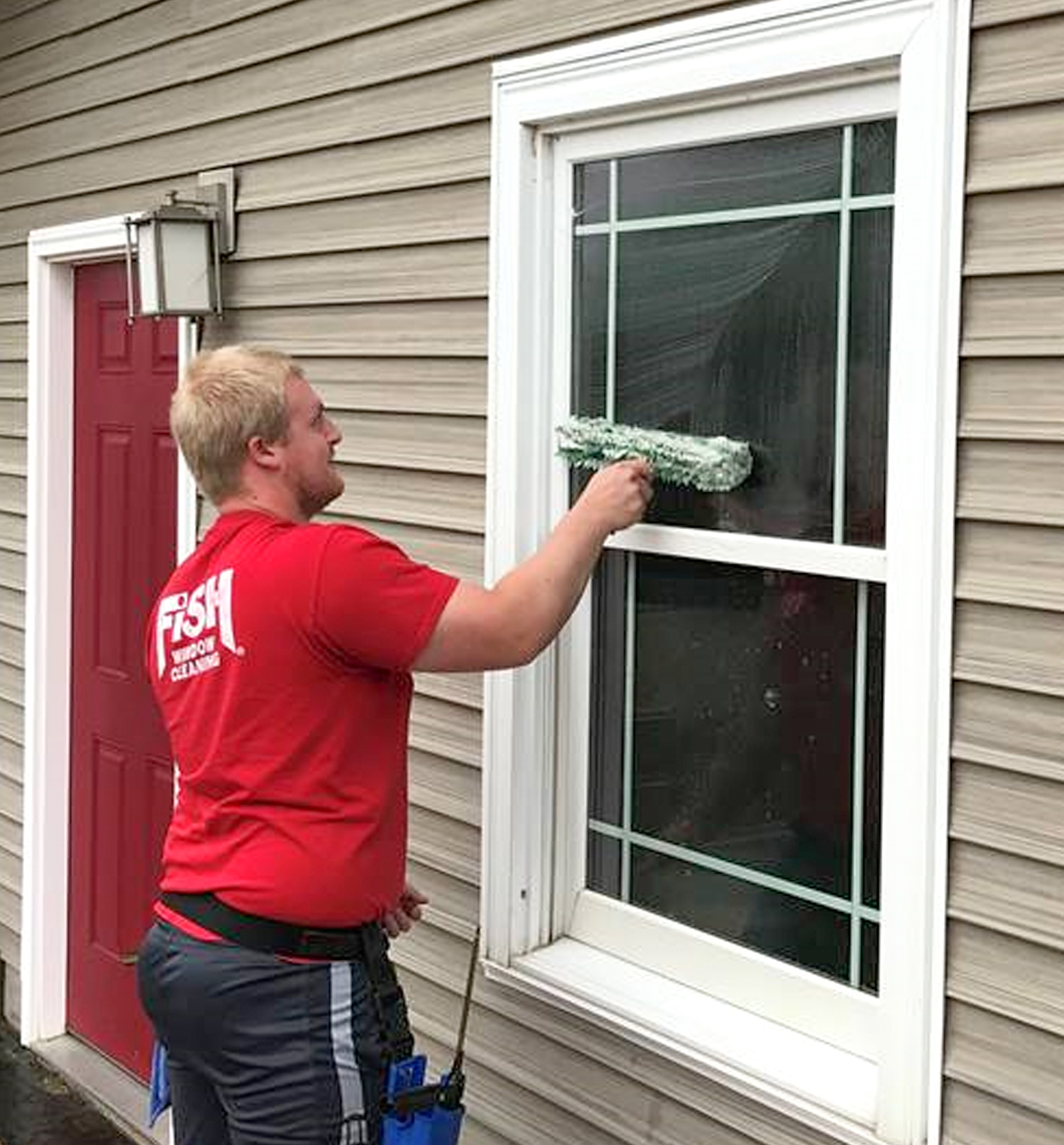 Fish Window Cleaner Using Mop to Clean Exterior Home Window